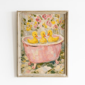 May include: A framed painting featuring three yellow rubber ducks sitting inside a pink clawfoot bathtub. The background displays a floral pattern with pink and yellow blossoms, while the foreground shows a tiled floor in shades of green and white.