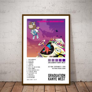 May include: A framed poster for Kanye West's album "Graduation." The artwork features a cartoon bear in a blue jacket against a purple sky. The poster includes the album's tracklist, release date, and album title.