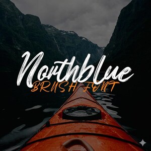 May include: An orange kayak glides across dark water, with the text "Northblue BRUSH FONT" in white and orange. Mountains and a cloudy sky form the backdrop, creating a scenic and adventurous feel. The font appears to be a brush style.