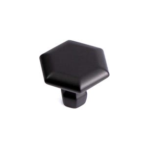 May include: A black, hexagonal cabinet knob with a square base. The knob has a matte finish and is designed for furniture such as drawers and cabinets. The hardware is shown against a white background.