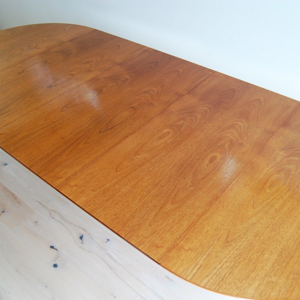 Danish Mid Century Modern Hanning Kjaernulf Teak Round to Oval Dining Table with Three Leaves and Protective Covers  Made in Denmark