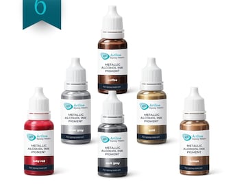 May include: A set of six Artline Epoxy Resin metallic alcohol ink pigment bottles. The colors include ruby red, silver gray, coffee, dark gray, gold, and brown. Each bottle features a white cap and a label with the product name and color.