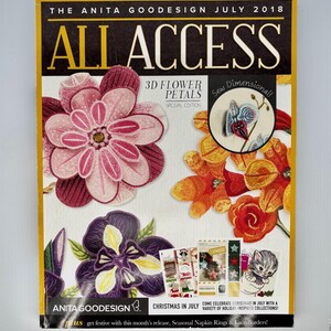 May include: A magazine titled The Anita Goodesign July 2018 All Access featuring 3D flower petals in pink, purple, and orange. The cover displays embroidered floral designs, a circular inset, and text including Christmas in July and Sew Dimensional.