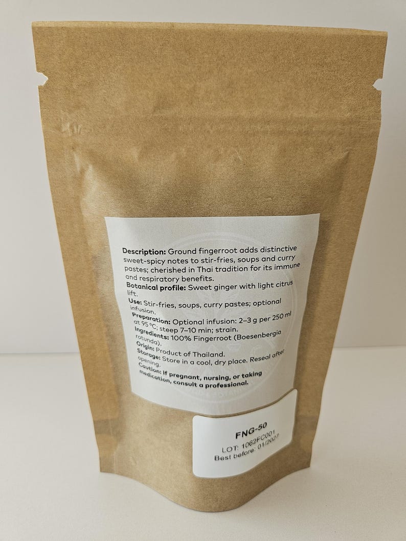 May include: A brown paper bag containing ground fingerroot. The bag features a white label detailing the product's description, usage, preparation, ingredients, and origin. The text on the label is in English.