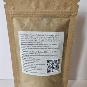 May include: A brown paper stand-up pouch containing finely milled pandan leaf powder. A white label on the front features the text: Description: Finely milled pandan leaf powder with a naturally sweet-green aroma and soft vanilla-like character.