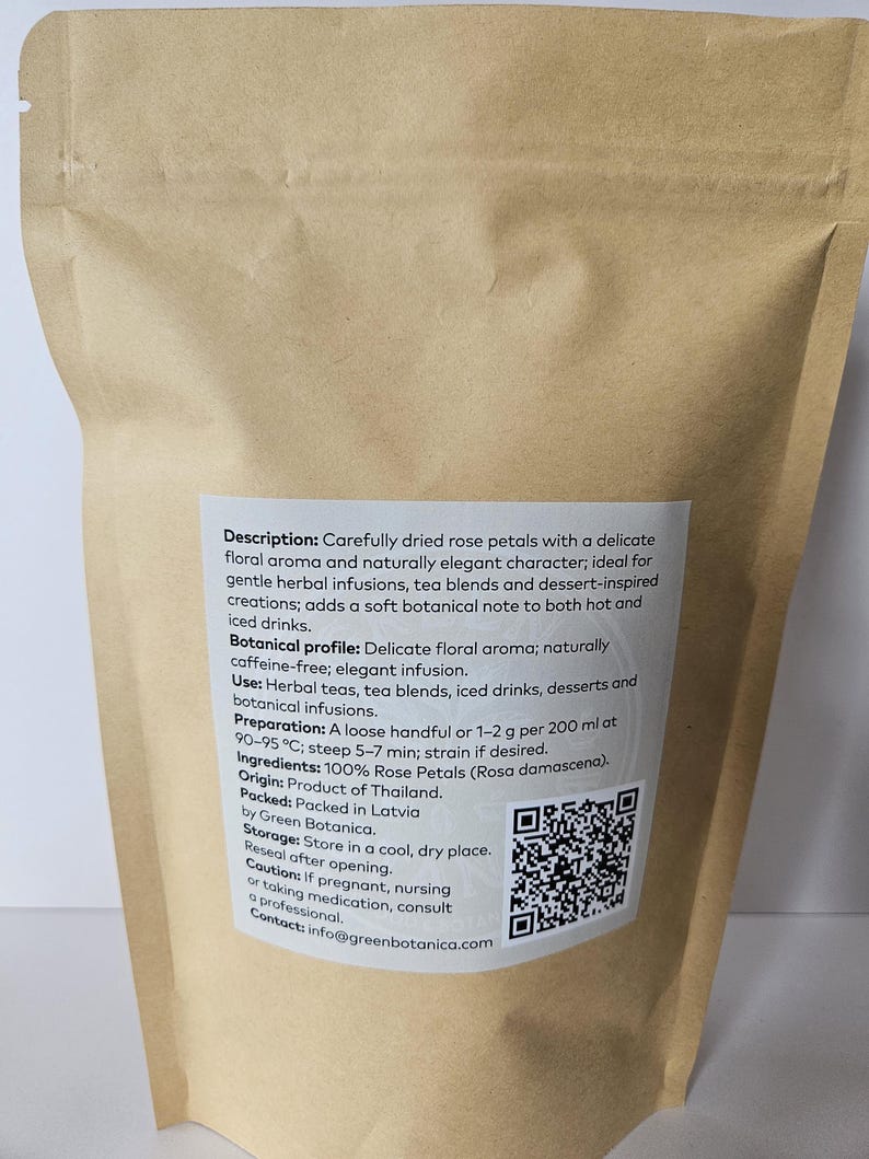 May include: A brown paper bag containing dried rose petals. The label describes the product as having a delicate floral aroma, suitable for herbal infusions and iced drinks. The bag includes a QR code and contact information.