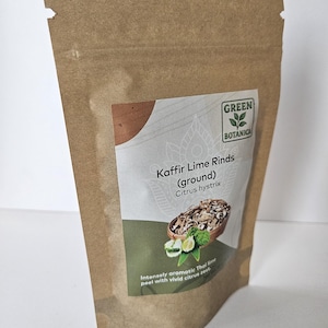 May include: A brown paper bag of Kaffir Lime Rinds (ground) from Green Botanica. The label shows a picture of the lime rinds and the text "Intensely aromatic Thai lime peel with vivid citrus zest."