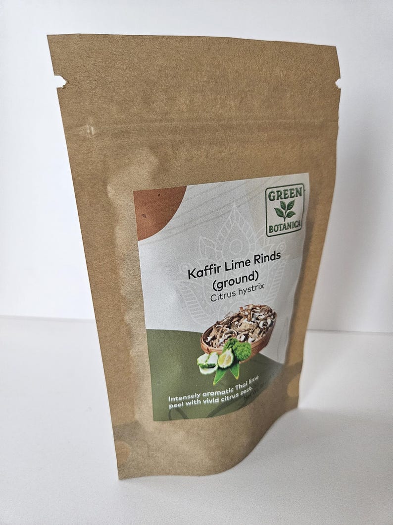 May include: A brown paper bag of Kaffir Lime Rinds (ground) from Green Botanica. The label shows a picture of the lime rinds and the text "Intensely aromatic Thai lime peel with vivid citrus zest."