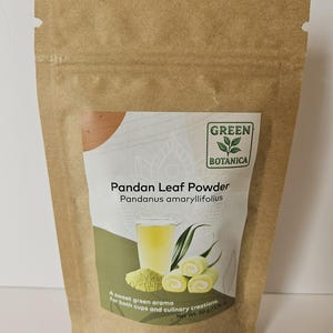 May include: A brown paper pouch of Green Botanica Pandan Leaf Powder, Pandanus amaryllifolius. The label features a glass of green liquid, a pile of green powder, and two green-swirled rolls, with the text: A sweet green aroma for both cups and culinary creations. Net Wt. 50 g / 1.76 oz.