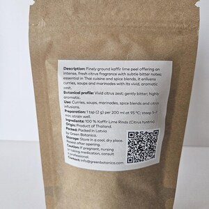May include: A brown paper bag containing finely ground kaffir lime peel. The label details the product's fragrance, uses in Thai cuisine, and preparation instructions. The label also includes a QR code and contact details.