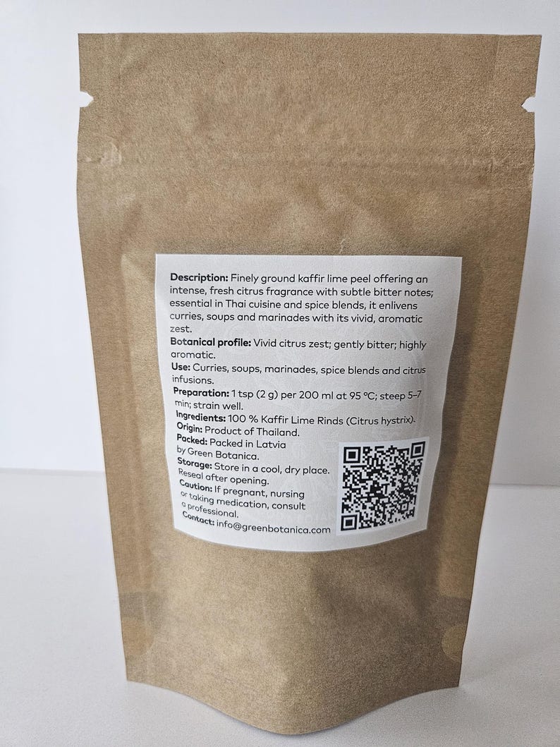May include: A brown paper bag containing finely ground kaffir lime peel. The label details the product's fragrance, uses in Thai cuisine, and preparation instructions. The label also includes a QR code and contact details.