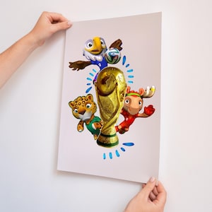 May include: A rectangular poster featuring a central gold FIFA World Cup trophy surrounded by three cartoon mascots: a white eagle in a blue jersey, a spotted leopard in a green shirt, and a brown moose in a red jersey with a soccer ball.
