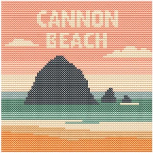 May include: Cross-stitch artwork depicting Cannon Beach. The design features a large, dark gray rock formation, smaller rocks, and a beach scene. The sky is a gradient of pink and peach, with the words "CANNON BEACH" in white.