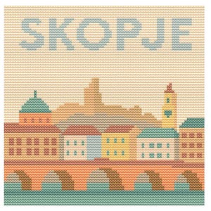 May include: Cross-stitch design featuring the word "SKOPJE" above a colorful cityscape. The image depicts buildings, a bridge, and a river in shades of orange, blue, green, and yellow, with a beige background.