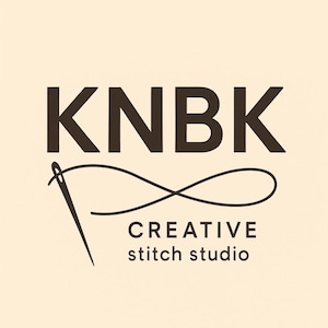 May include: Logo for a creative stitch studio, featuring the letters "KNBK" in a dark brown font above the words "CREATIVE stitch studio" in a smaller font. A needle and thread design is incorporated into the logo.