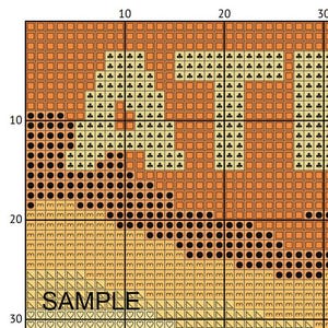 May include: A cross-stitch pattern with the word "SAMPLE" at the bottom. The word "LIFE" is stitched in a light tan color with black and tan accents. The background is a gradient of tan and orange.