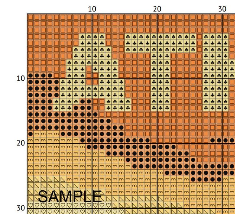 May include: A cross-stitch pattern with the word "SAMPLE" at the bottom. The word "LIFE" is stitched in a light tan color with black and tan accents. The background is a gradient of tan and orange.