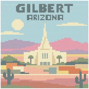 May include: Cross-stitch design featuring the text "GILBERT ARIZONA" above a cream-colored building with a tall spire, set against a desert landscape. The scene includes mountains, cacti, and a sun, all rendered in a pixelated style with a variety of pastel colors.