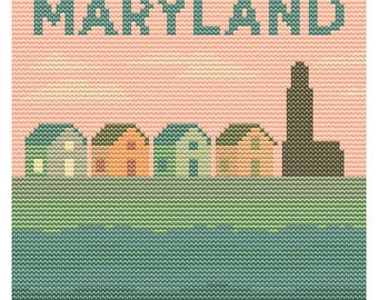 May include: A cross-stitch design featuring the word "MARYLAND" in teal above a row of colorful houses and a tall structure, likely a lighthouse. The background is a gradient of pink and the bottom is a teal blue.