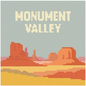 May include: Cross-stitch artwork depicting Monument Valley. The design features the text "MONUMENT VALLEY" above a landscape of red rock formations, a yellow and orange desert floor, and a light blue sky.