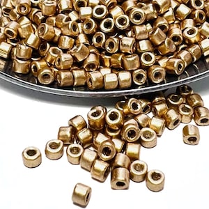 May include: A set of three ceramic mugs with a speckled, matte finish. The mugs are in shades of cream, light gray, and dark gray. Each mug has a simple, minimalist design, perfect for coffee or tea.