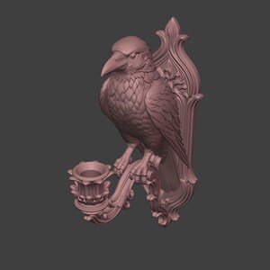 May include: A mauve-colored wall sconce featuring a sculpted raven perched atop a candle holder. The piece is mounted on an ornate, vertically elongated backplate with intricate relief detailing, showcasing a bird with textured feathers.