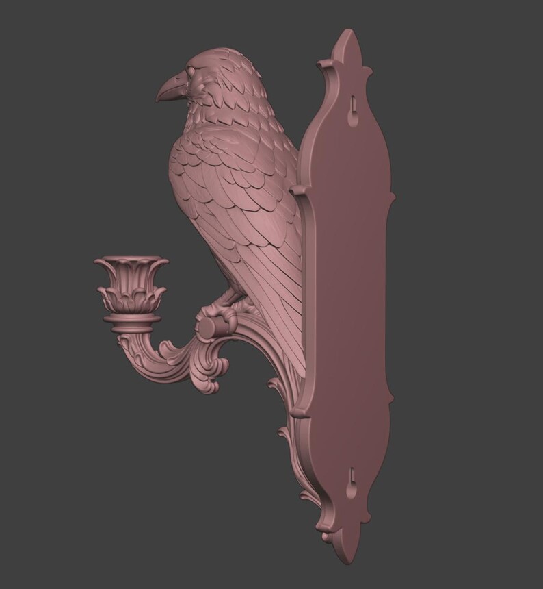 May include: A mauve-colored wall-mounted candle holder featuring a sculpted raven perched on a curved, ornate branch. The piece includes a decorative candle cup and a vertical backplate with two keyhole slots for mounting to a flat surface.
