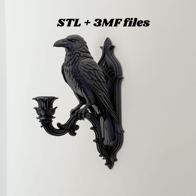 May include: A black wall-mounted candle holder featuring a sculpted raven perched on a decorative bracket with an ornate base. The text STL + 3MF files is displayed above the object, indicating the digital nature of this 3D printable design.