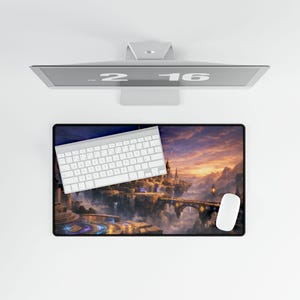 Peut inclure: Un ensemble informatique avec un clavier et une souris blancs, ainsi qu'un tapis de souris avec un paysage fantastique. L'écran affiche l'heure 2:16. Le tapis de souris présente un château avec des ponts et un coucher de soleil.