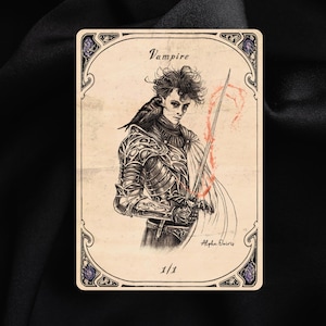May include: An illustrated card depicting a vampire figure with a raven, holding a sword. The card has an ornate border with the word "Vampire" at the top. The artist's signature is visible.