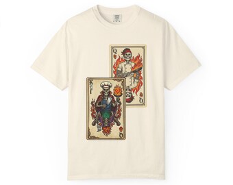 May include: Off-white t-shirt displaying two playing cards with skeleton chefs. The King card shows a skeleton in a chef's hat and cape, while the Queen card depicts a skeleton holding a gun, both surrounded by flames. The cards are in a vintage tattoo style.