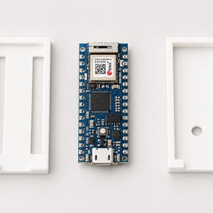 May include: A blue rectangular microcontroller board with a silver metal module and a micro-USB port, positioned between two white plastic rectangular frames. The central board features a square chip, various small components, and a QR code.