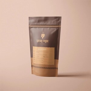 May include: A brown and tan coffee bag with the text "Safari Pride Coffee" and a lion logo. The bag also has the text "Burundi Ngozi" and other details. The bag is standing upright against a light pink background.