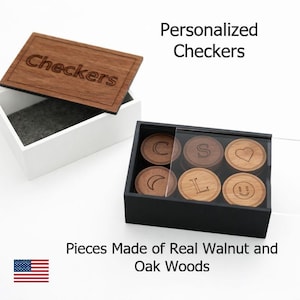 May include: A personalized checkers set with a wooden lid engraved with "Checkers." The set includes a black box with wooden game pieces, each engraved with a letter, symbol, or smiley face. The text reads "Personalized Checkers" and "Pieces Made of Real Walnut and Oak Woods."