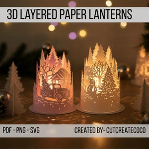 Könnte beinhalten: Zwei 3D-Papierlaternen mit Winterthema. Eine Laterne zeigt einen LKW mit einem Weihnachtsbaum, die andere einen Schneemann. Die Laternen sind weiß mit aufwendigen Ausschnitten, und der Text "3D LAYERED PAPER LANTERNS" steht oben.