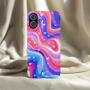 May include: A colorful phone case with a swirling design of pink, purple, blue, and orange. The case features a pattern of hearts and stars. The phone case has a camera cutout at the top.
