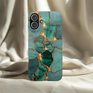 May include: A teal and gold phone case with a marbled design. The case features a pattern of teal and green stone-like shapes, separated by gold-colored lines. The phone's camera lenses are visible at the top.