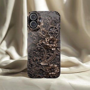 May include: A phone case with a detailed, steampunk-inspired design. The case features a dark brown floral pattern with gears and other mechanical elements. The case has a dual-lens camera cutout.