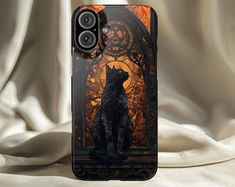 May include: Black phone case featuring a stylized black cat sitting in front of a stained-glass window design. The window has an orange and brown color scheme. The phone case has a glossy finish.