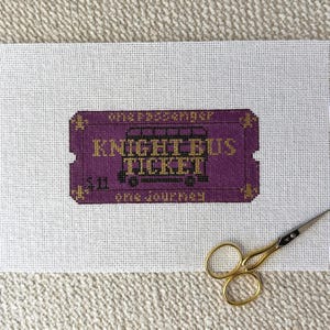 May include: A white ceramic mug with a black handle and the text "But First, Coffee" in a bold, black font. The mug is set against a blurred background, suggesting a cozy setting. The mug appears to be approximately 4 inches tall.