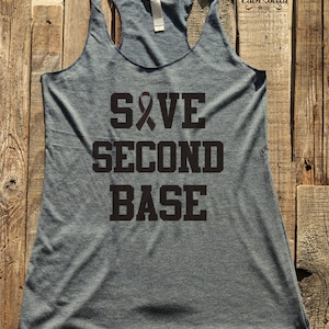 May include: Gray tank top with a black ribbon and the text "SAVE SECOND BASE" printed on the front.
