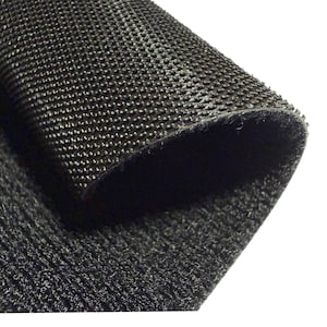 May include: Close-up of a black, textured fabric with a woven pattern. The fabric is folded over, revealing a layered effect and a glimpse of the underside. The material appears durable and slightly reflective, with a dense, tactile surface.