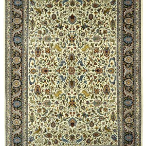 May include: Ivory-colored rectangular rug with an intricate floral pattern. The rug features a central design of flowers and leaves in shades of blue, brown, and gold. A dark border with floral motifs frames the rug.