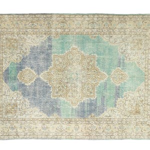 Hand-knotted vintage Oushak rug 7.2x10.3 ft aqua blue and sand beige with central medallion, styled for coastal living room or serene bedroom setting.
