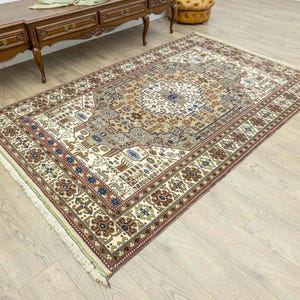 vintage anatolian oushak area rug 5'4''x8'6'', neutral beige cream brown terracotta palette with navy green burgundy accents, soft low pile handwoven organic wool rug, classic elegant living room decor
