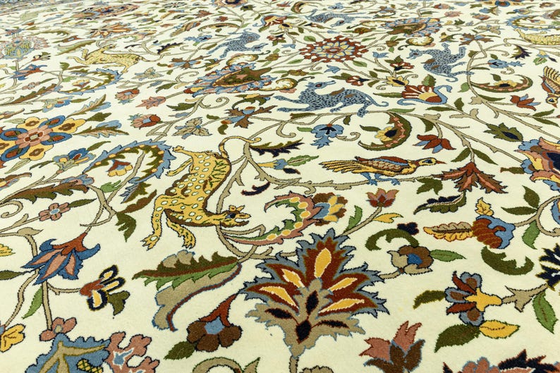 May include: Cream-colored rug with an intricate floral and animal pattern. The design features stylized birds, leopards, and floral elements in shades of blue, yellow, brown, and green. The rug's detailed design adds a touch of elegance.