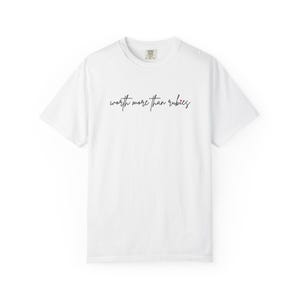 May include: White t-shirt with the handwritten text "worth more than rubies" in black script across the chest. The shirt has a crew neck and short sleeves. The fabric appears to be a soft cotton blend.