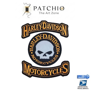 May include: Embroidered Harley-Davidson patches in black and gold. The patches feature the Harley-Davidson logo and a skull design. The word "MOTORCYCLES" is also displayed on the patches. The patches are likely for jackets or vests.