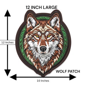 May include: Large embroidered wolf patch, 12 inches tall and 10 inches wide. The patch features a detailed wolf face with brown, white, and tan fur, yellow eyes, and a green border. The text "WOLF PATCH" is below the patch.
