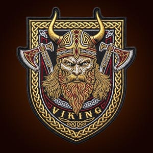 May include: An embroidered patch featuring a central Viking warrior with a horned helmet, long beard, and intense expression. Two crossed axes flank the figure within a shield-shaped border decorated with gold Celtic knotwork and the text VIKING.